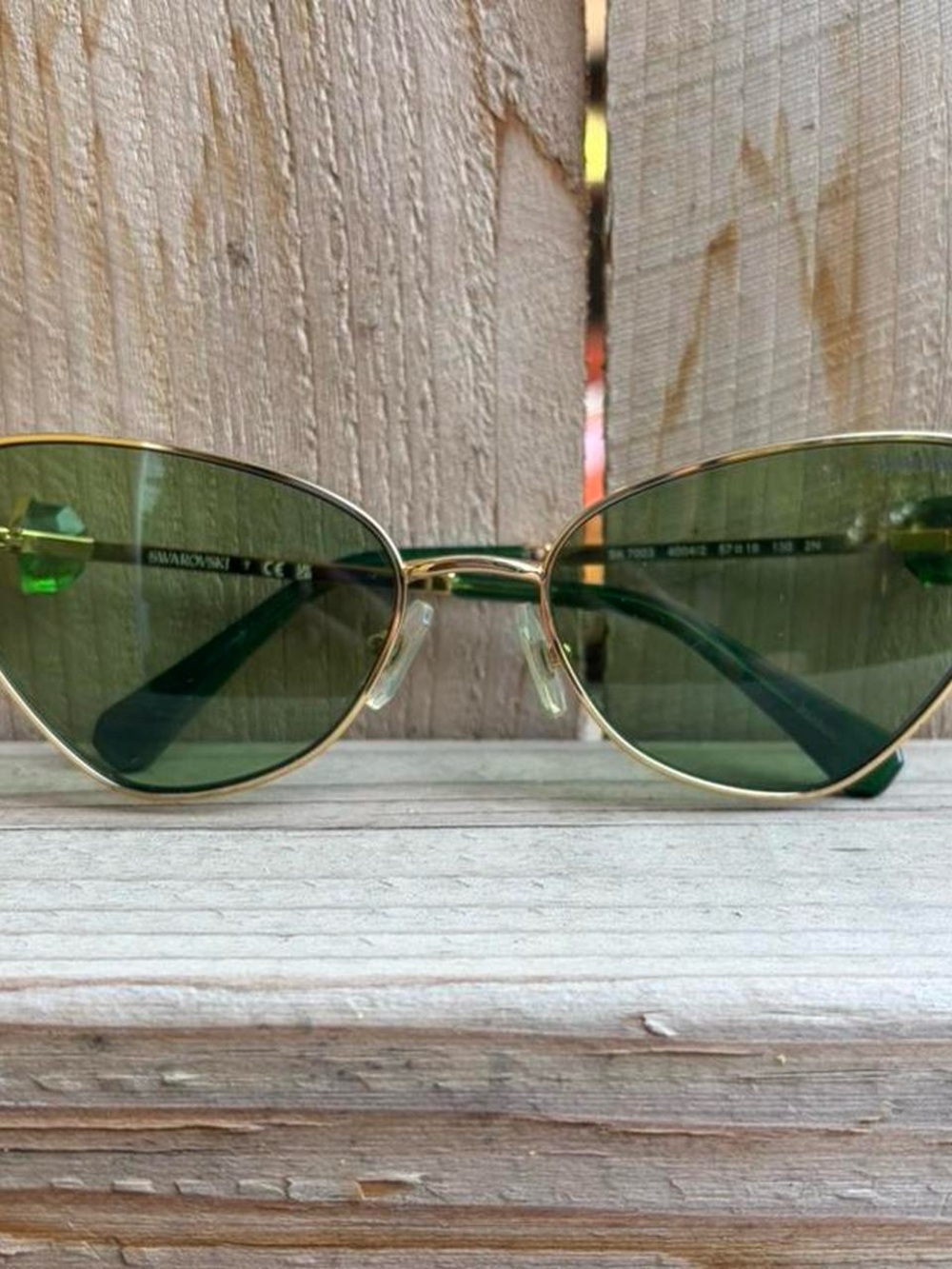 Swarovski Gold-Frame Cat Eye Sunglasses with Green Lenses
